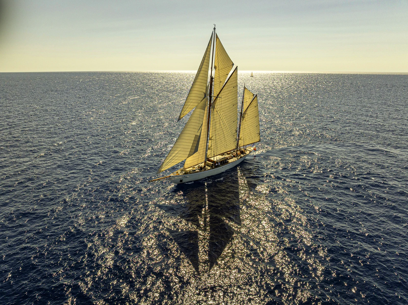 Sailing yacht under golden light